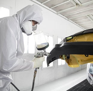 Collision Center Technician Painting a Vehicle | Balise Toyota in West Springfield MA