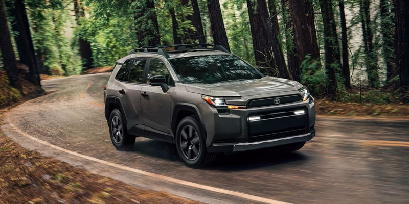 2024 Toyota RAV4 driving on forest road